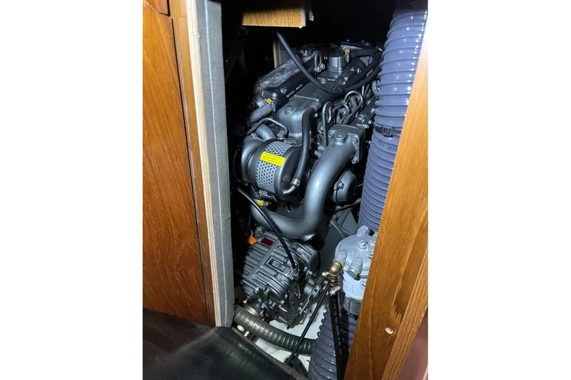 Arrow Yacht Photos Pics Engine compartment of 2008 Jeanneau Sun Odyssey 45 sailboat, showcasing mechanical components.