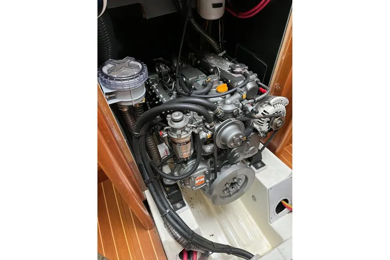 Arrow Yacht Photos Pics Engine compartment of 2008 Jeanneau Sun Odyssey 45 sailboat, showcasing detailed mechanical components.
