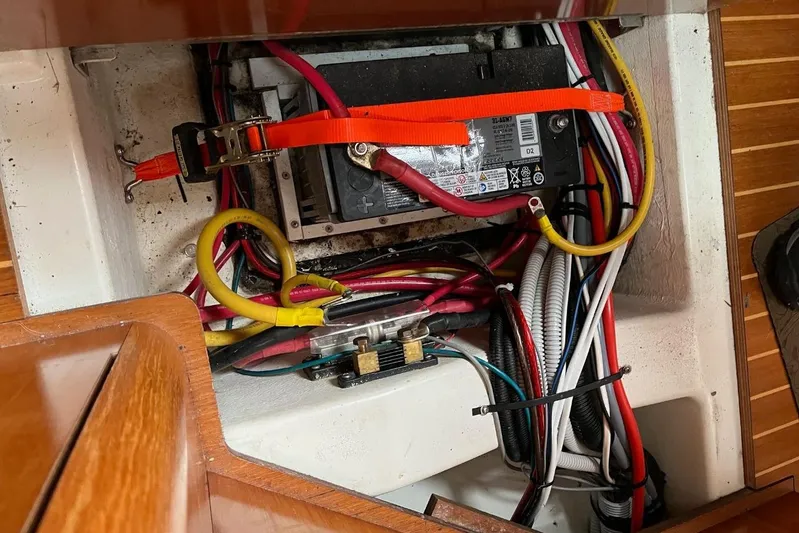 Arrow Yacht Photos Pics Battery compartment of 2008 Jeanneau Sun Odyssey 45 with wiring and securing straps.