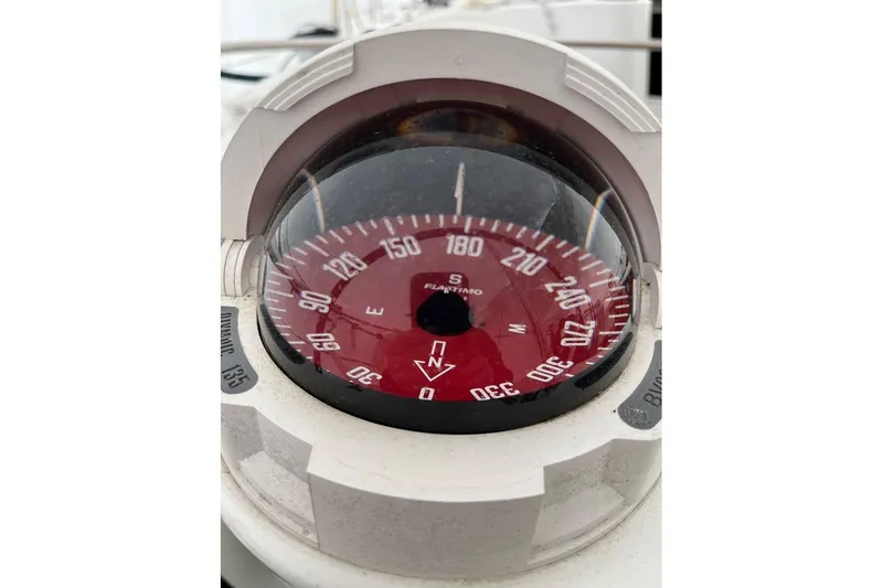 Arrow Yacht Photos Pics Compass on 2008 Jeanneau Sun Odyssey 45 sailboat, displaying cardinal directions.