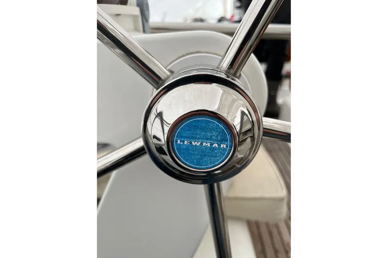 Arrow Yacht Photos Pics Steering wheel of 2008 Jeanneau Sun Odyssey 45 sailboat with Lewmar logo.