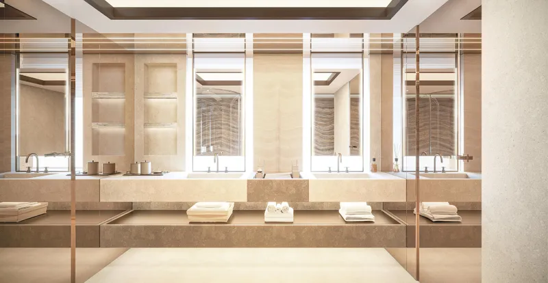  Yacht Photos Pics Luxurious modern bathroom with double sinks, large mirrors, and elegant beige decor.