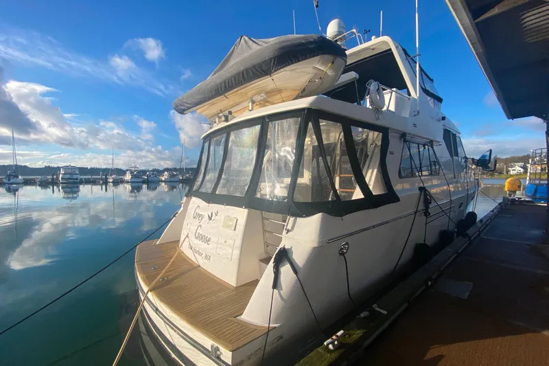 Grey Goose Yacht Photos Pics Compass 55 yacht docked at marina, clear sky, calm water, 2000 model.