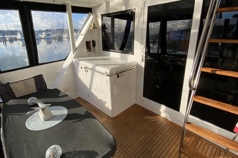 Grey Goose Yacht Photos Pics Interior of 2000 Compass 55 yacht with wooden flooring and modern decor.