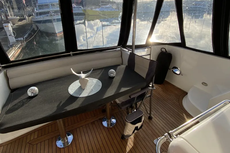 Grey Goose Yacht Photos Pics Interior of a 2000 Compass 55 yacht with elegant seating and decor.