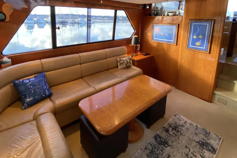 Grey Goose Yacht Photos Pics Luxurious interior of 2000 Compass 55 yacht with leather seating and elegant decor.