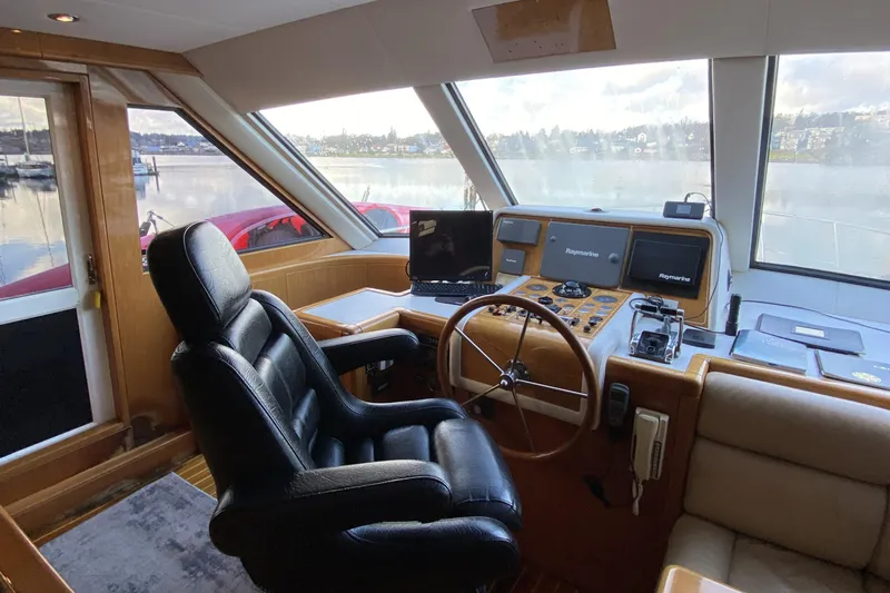 Grey Goose Yacht Photos Pics Luxurious helm of a 2000 Compass 55 yacht with leather seating and advanced navigation systems.