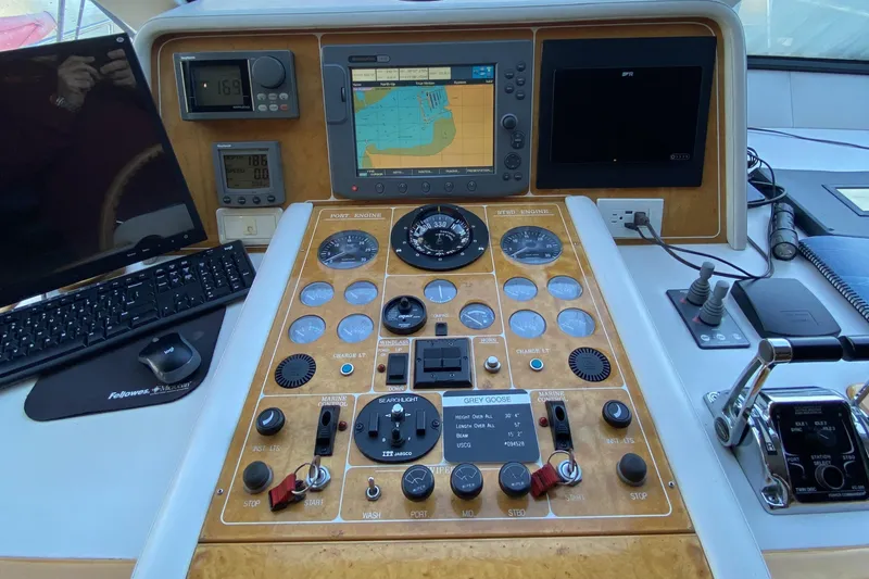 Grey Goose Yacht Photos Pics Control panel of a 2000 Compass 55 boat with navigation instruments and displays.