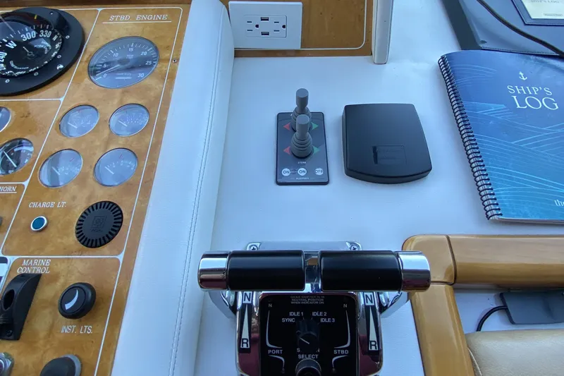 Grey Goose Yacht Photos Pics Boat control panel with gauges, levers, and ship's log book, Compass 55, year 2000.