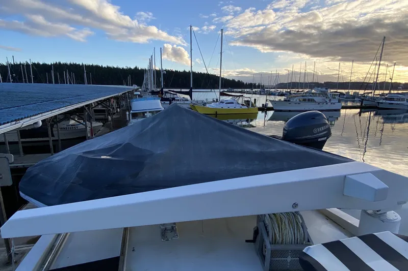Grey Goose Yacht Photos Pics Boat docked at marina during sunset, featuring Compass 55 model from 2000.