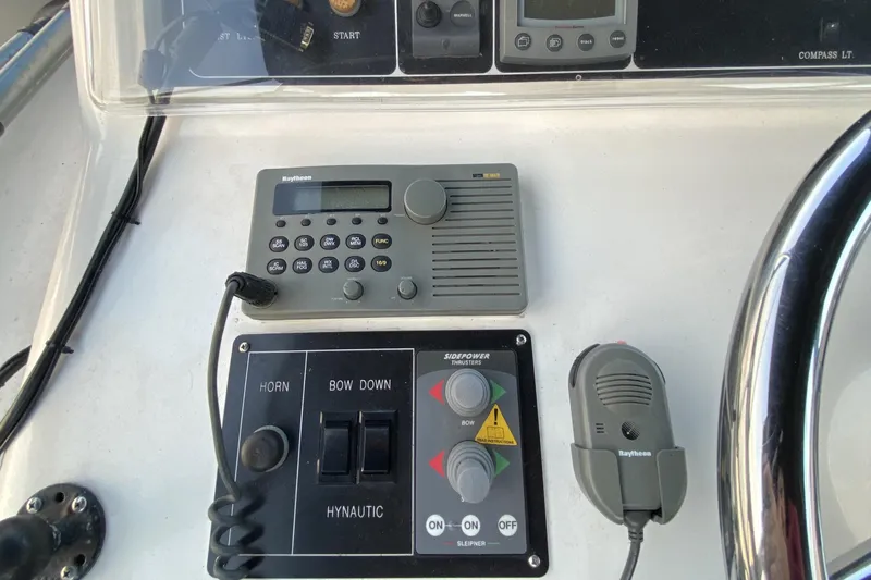 Grey Goose Yacht Photos Pics Boat control panel with Raytheon radio and Side-Power thruster controls, Compass 55, year 2000.