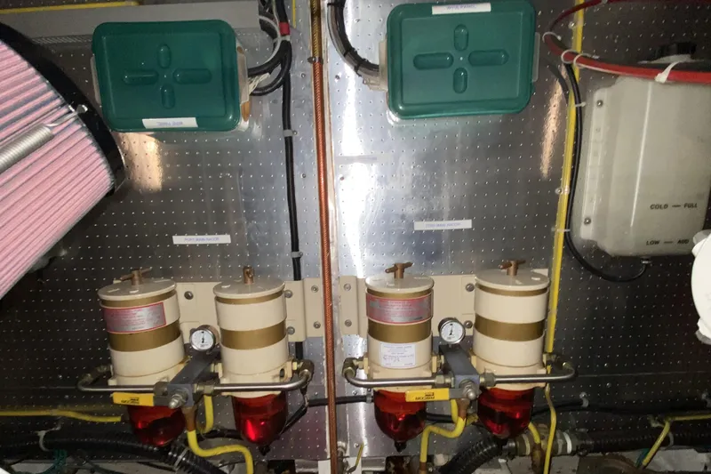 Grey Goose Yacht Photos Pics Engine room components of a 2000 Compass 55, featuring filters and wiring.