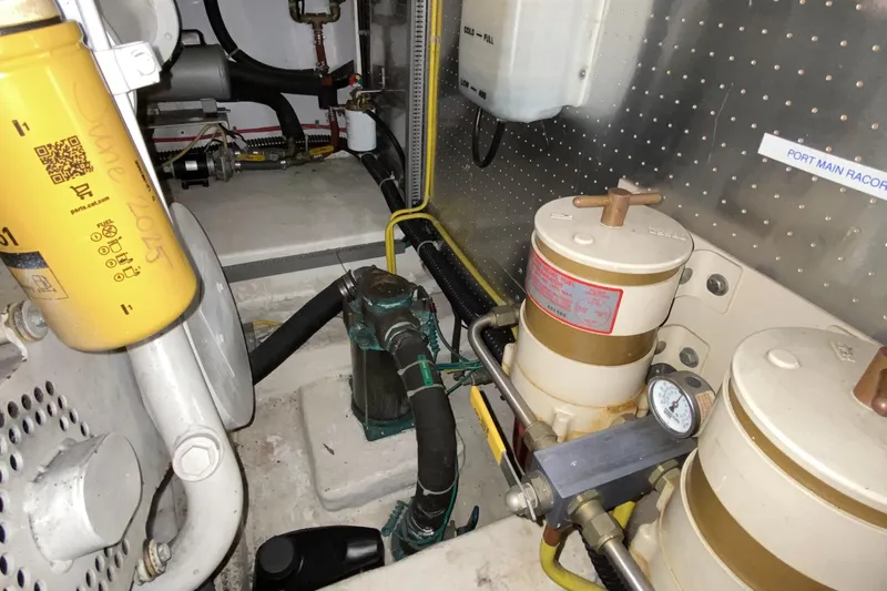 Grey Goose Yacht Photos Pics Engine room of a 2000 Compass 55 yacht with fuel filters and mechanical components.