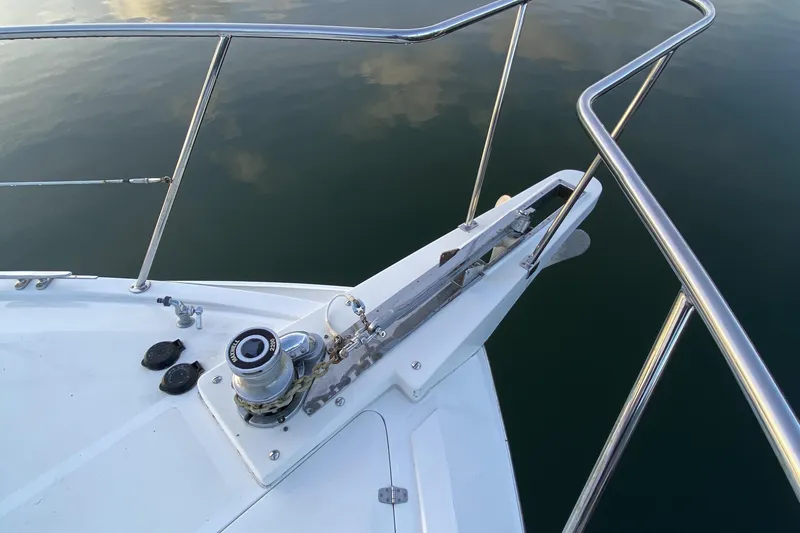 Grey Goose Yacht Photos Pics Bow of Compass 55 boat, 2000 model, with stainless steel railings and anchor winch.