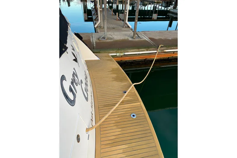 Grey Goose Yacht Photos Pics Compass 55 yacht docked, showcasing wooden deck and mooring line, year 2000 model.