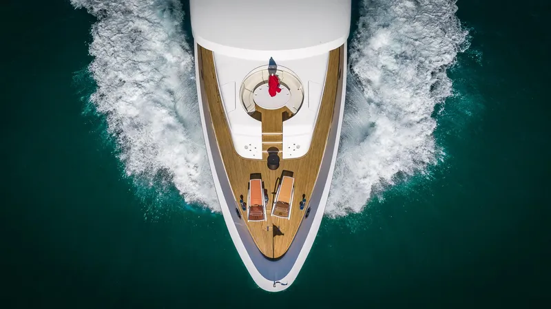 Scott Free Yacht Photos Pics Aerial view of 2008 President Tri-Deck yacht cruising through ocean waves.