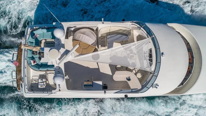 Scott Free Yacht Photos Pics Aerial view of 2008 President Tri-Deck yacht cruising on the ocean.