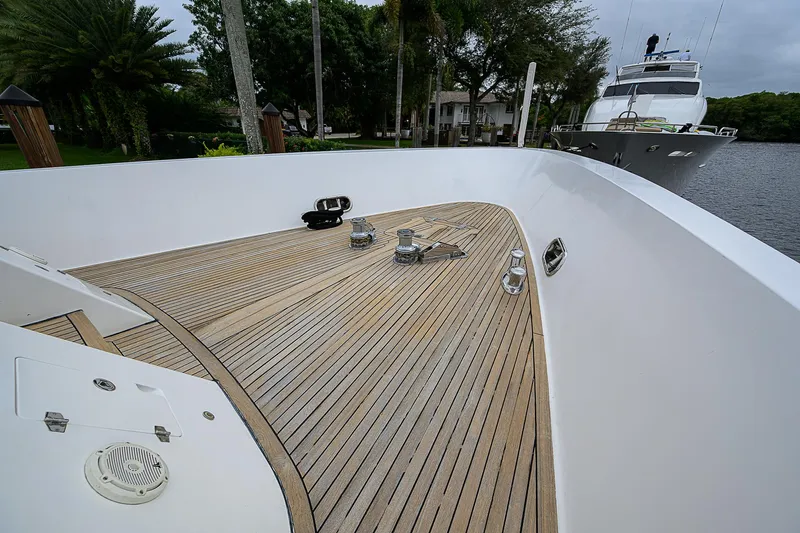 Scott Free Yacht Photos Pics 2008 President Tri-Deck yacht with spacious wooden deck and sleek design.
