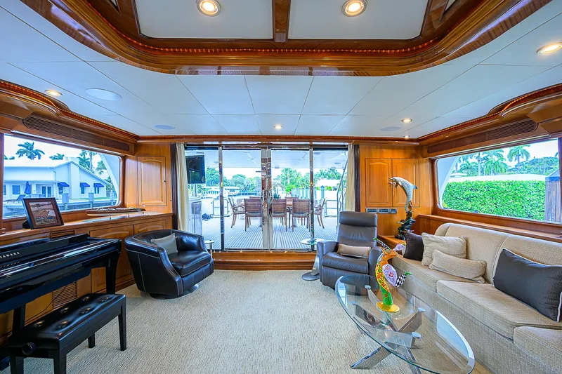 Scott Free Yacht Photos Pics Luxurious 2008 President Tri-Deck yacht interior with elegant seating and piano.