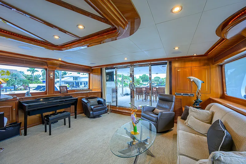 Scott Free Yacht Photos Pics Luxurious 2008 President Tri-Deck yacht interior with elegant seating and large windows.