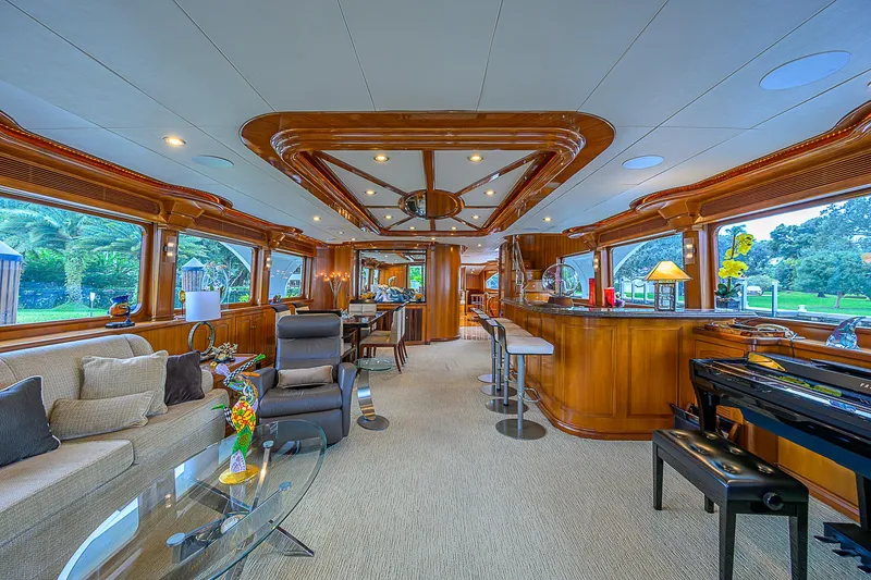 Scott Free Yacht Photos Pics Luxurious interior of 2008 President Tri-Deck yacht with elegant wood finishes and modern furnishings.