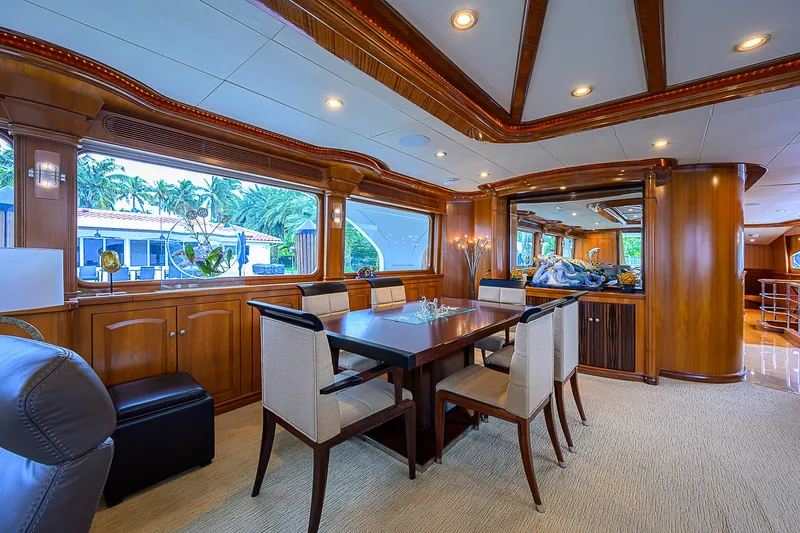 Scott Free Yacht Photos Pics Luxurious 2008 President Tri-Deck yacht interior with elegant dining area and wooden finishes.