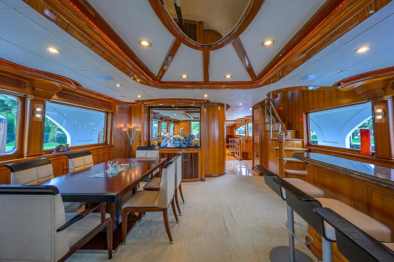 Scott Free Yacht Photos Pics Luxurious 2008 President Tri-Deck yacht interior with elegant dining area and modern design.