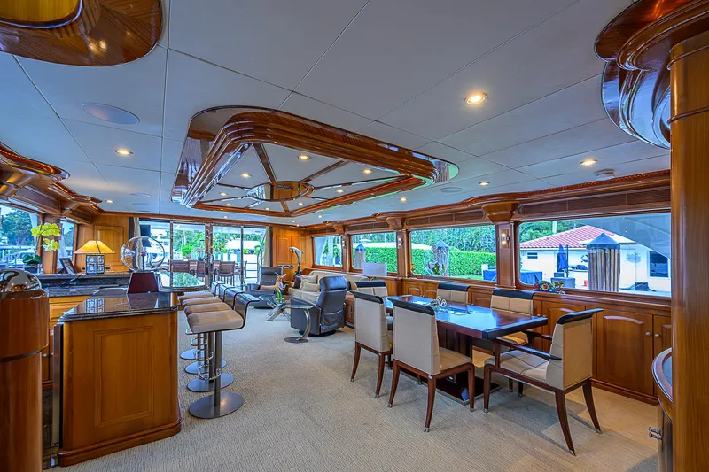 Scott Free Yacht Photos Pics Luxurious interior of 2008 President Tri-Deck yacht with elegant dining and seating areas.