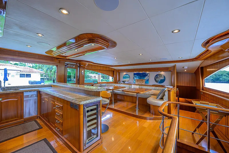 Scott Free Yacht Photos Pics Luxurious 2008 President Tri-Deck yacht interior with elegant wood finishes and modern amenities.