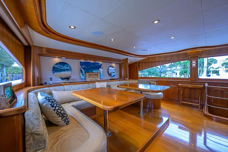 Scott Free Yacht Photos Pics Luxurious 2008 President Tri-Deck yacht interior with elegant wood finishes and plush seating.