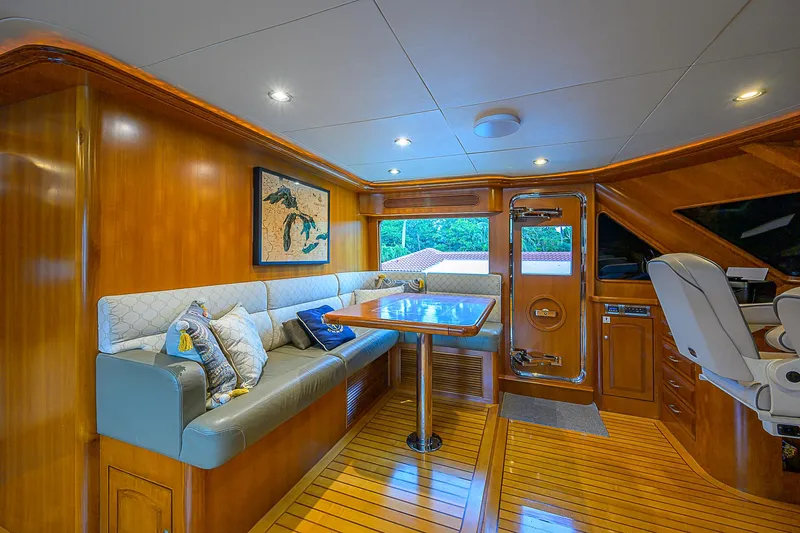Scott Free Yacht Photos Pics Luxurious 2008 President Tri-Deck yacht interior with elegant wood finishes and plush seating.