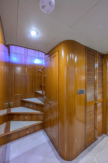 Scott Free Yacht Photos Pics Luxurious wooden interior of 2008 President Tri-Deck yacht with elegant staircase.
