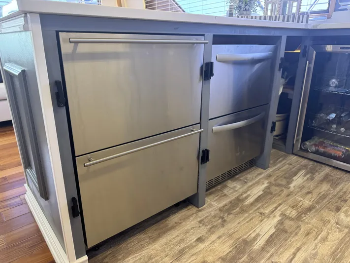 Negotiator Yacht Photos Pics Stainless steel kitchen appliances on a 1994 Hatteras 54 Convertible yacht.