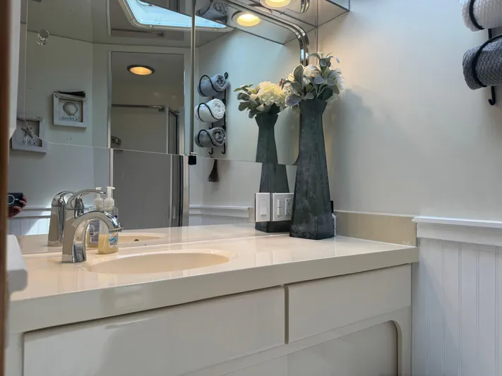 Negotiator Yacht Photos Pics Luxurious bathroom interior of 1994 Hatteras 54 Convertible yacht with elegant decor.