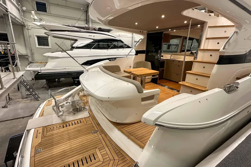 F45021 Yacht Photos Pics Luxury 2021 Princess F45 yacht interior with wooden deck and elegant seating area.
