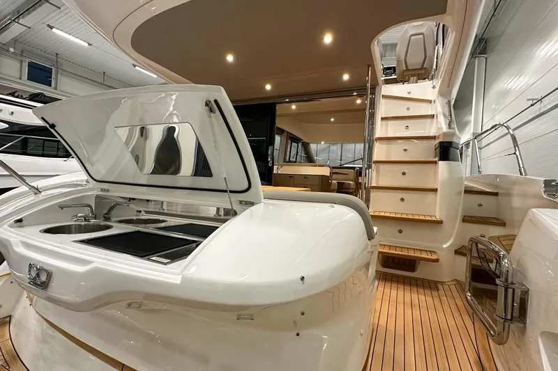 F45021 Yacht Photos Pics Luxury 2021 Princess F45 yacht interior with kitchenette and wooden stairs.
