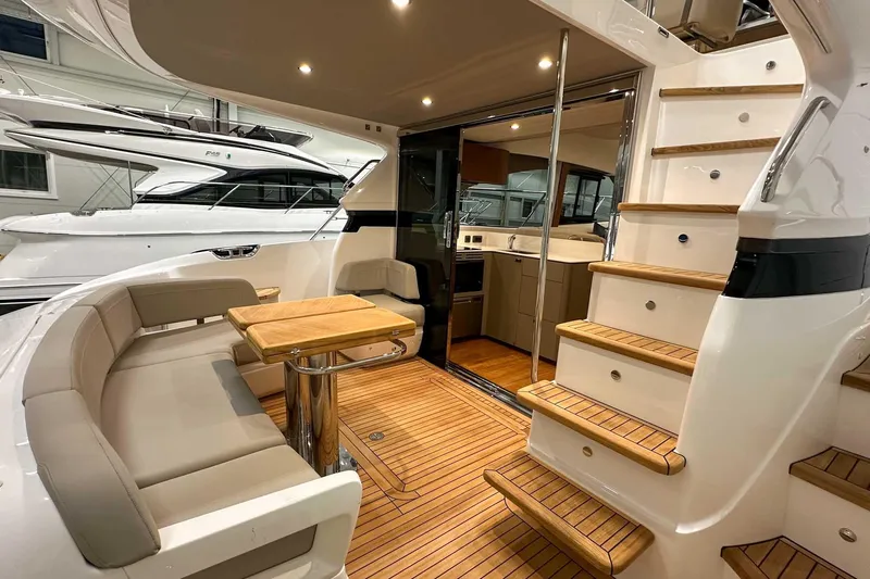 F45021 Yacht Photos Pics Luxurious 2021 Princess F45 yacht interior with elegant seating and wooden flooring.