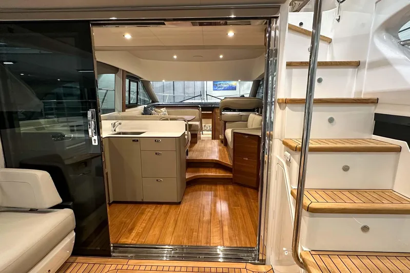 F45021 Yacht Photos Pics Interior view of 2021 Princess F45 yacht, featuring elegant wood flooring and modern furnishings.