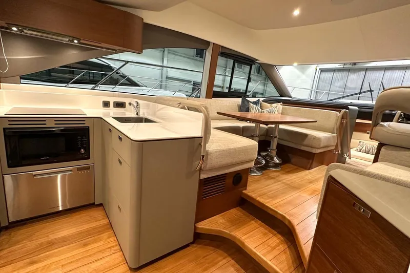 F45021 Yacht Photos Pics Luxurious interior of 2021 Princess F45 yacht with modern kitchen and dining area.