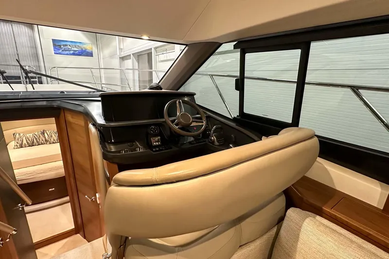 F45021 Yacht Photos Pics Interior of 2021 Princess F45 yacht showing helm and seating area.