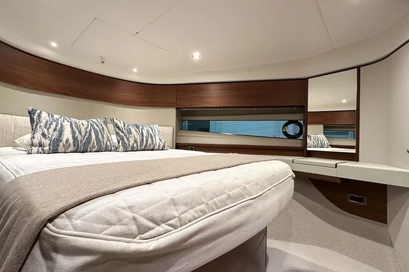 F45021 Yacht Photos Pics Luxurious bedroom interior of 2021 Princess F45 yacht with elegant bedding and modern design.
