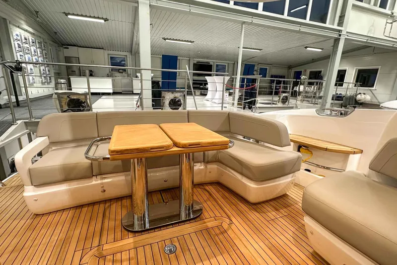 F45021 Yacht Photos Pics Luxurious 2021 Princess F45 yacht interior with elegant seating and wooden table.