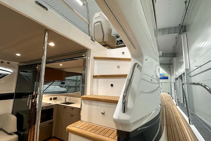 F45021 Yacht Photos Pics Interior view of 2021 Princess F45 yacht, featuring elegant stairs and modern kitchen area.