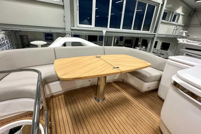 F45021 Yacht Photos Pics Luxurious 2021 Princess F45 yacht interior with elegant seating and wooden table.