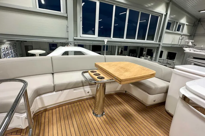 F45021 Yacht Photos Pics Luxurious 2021 Princess F45 yacht interior with elegant seating and wooden table.