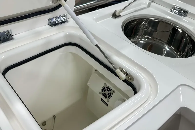 F45021 Yacht Photos Pics Open storage compartment on 2021 Princess F45 yacht, featuring stainless steel and white finish.