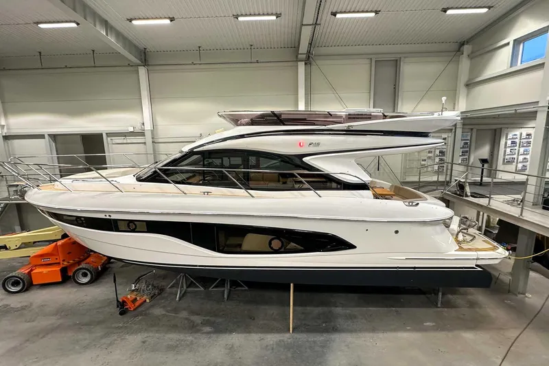 F45021 Yacht Photos Pics 2021 Princess F45 yacht in a modern indoor showroom setting.