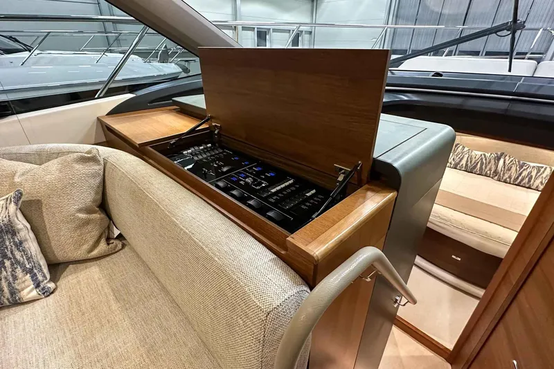 F45021 Yacht Photos Pics Interior of 2021 Princess F45 yacht with open control panel and luxurious seating.