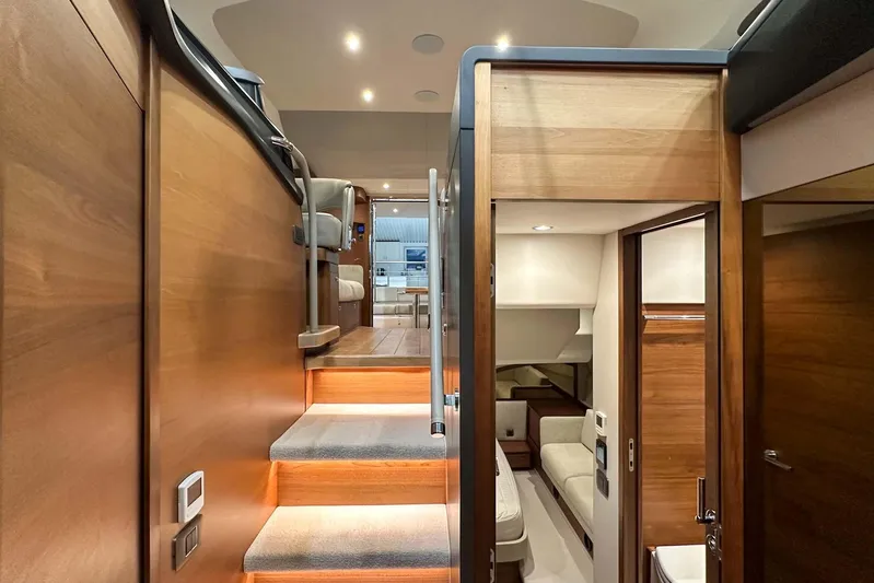 F45021 Yacht Photos Pics Luxurious interior of 2021 Princess F45 yacht with modern wood finishes and ambient lighting.