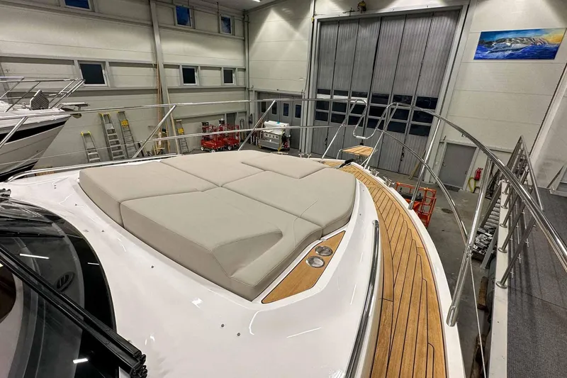 F45021 Yacht Photos Pics Luxurious 2021 Princess F45 yacht with spacious sunbathing deck in a modern indoor facility.